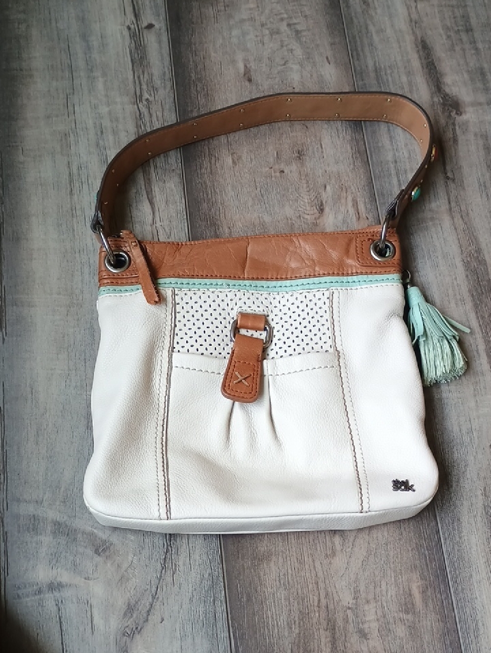 The Sak Cream Shoulder Bag with Tan Trim and Mint Tassel